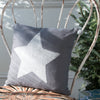 Pillow, hand appliquéd star with felted pom poms