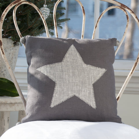 Pillow, hand appliquéd star with felted pom poms